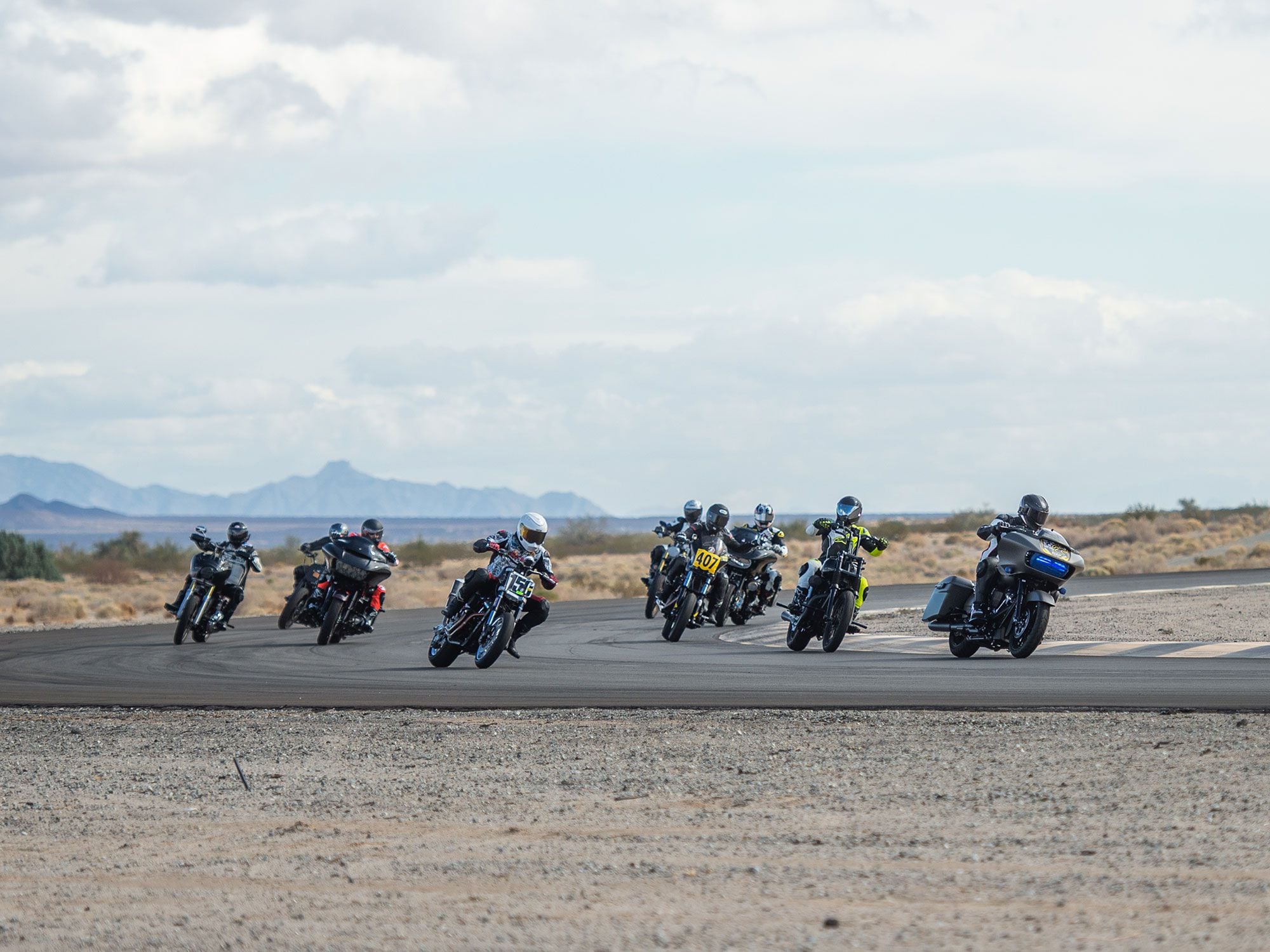 Baggers and Big Twins overlapping on an exhibition lap.